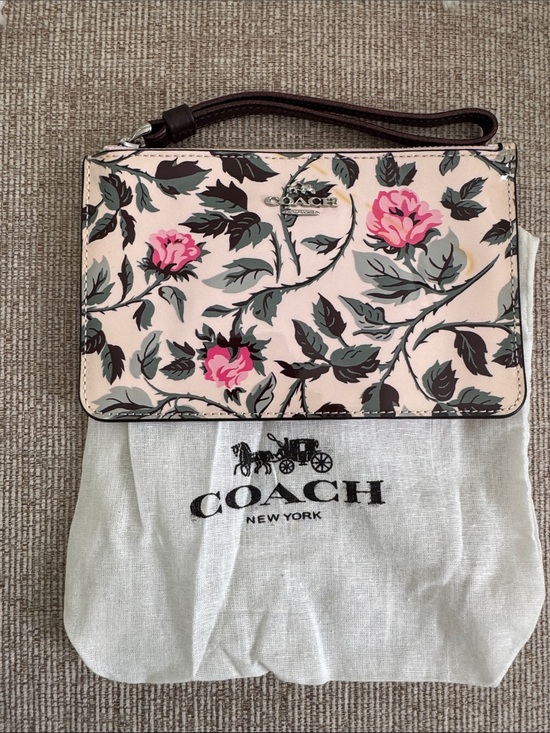 Coach Handbags - Coach Pink Floral Wristlet with Brown Strap and Pink Blooms